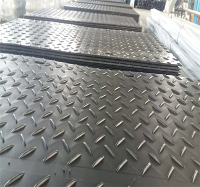 Black durable heavy duty ground protection temporary construction road mat